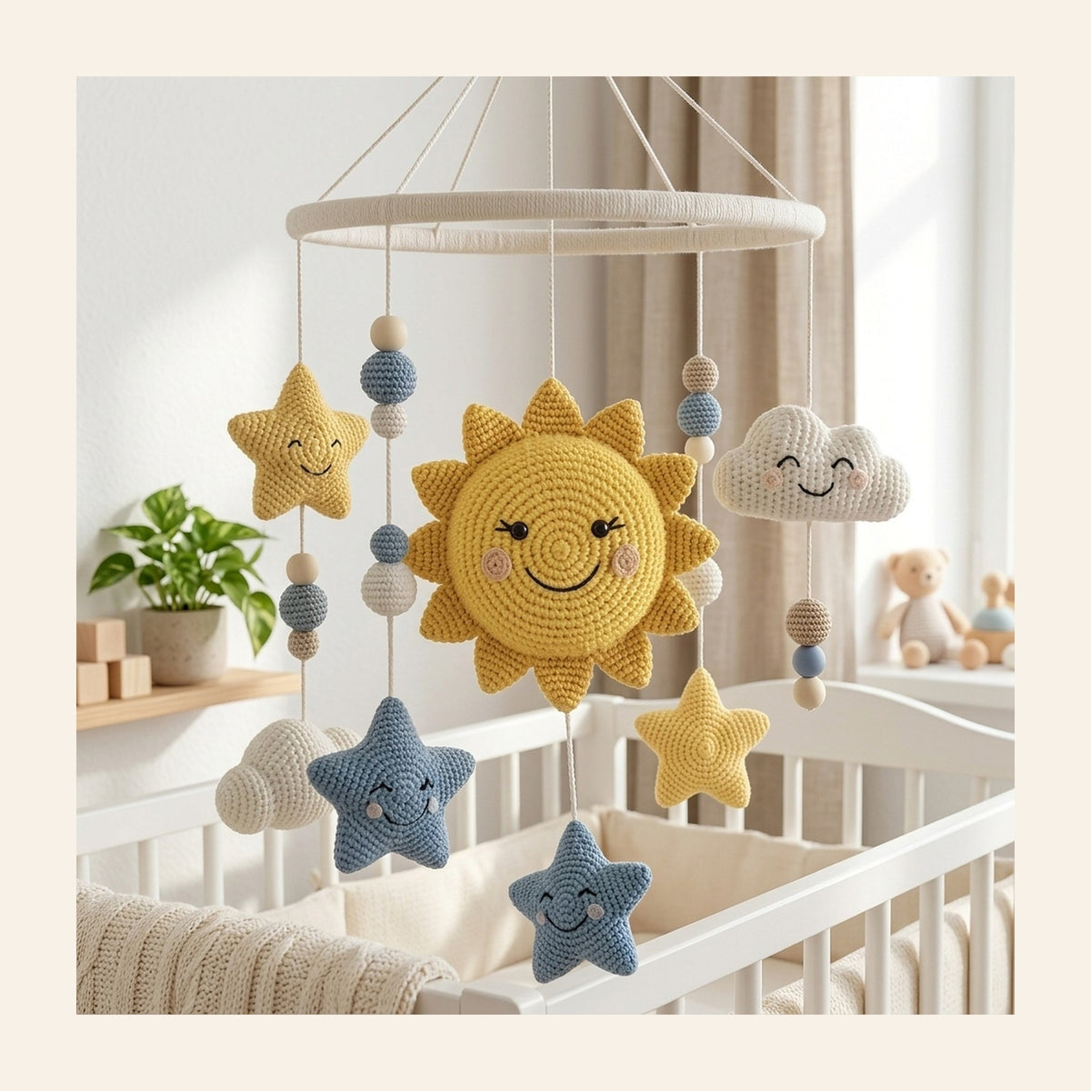 Crochet nursery mobile with a smiling sun, clouds and stars above a cot