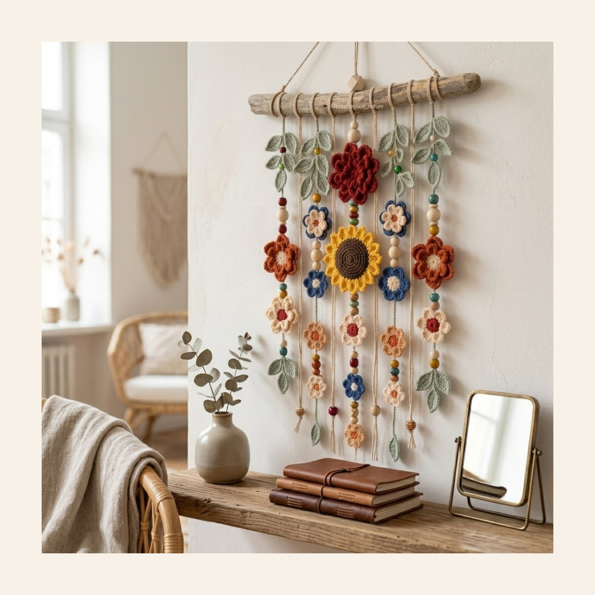 The sunflower crochet wall hanging styled above a wooden console